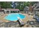 A refreshing in-ground pool with diving board and plenty of lounge chairs for relaxation at 2708 Coleberry Trl, Rocky Mount, NC 27804