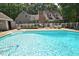 A beautiful in-ground pool surrounded by a white fence and lush greenery for a private backyard oasis at 2708 Coleberry Trl, Rocky Mount, NC 27804