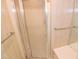 Clean shower features a glass door and tile surround and brushed metal fixtures at 2708 Coleberry Trl, Rocky Mount, NC 27804