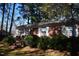 Charming brick home with white-framed windows and landscaped front yard at 2915 Ross Rd, Durham, NC 27703