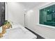 Modern bathroom featuring dual sinks, marble countertops, and a large window at 301 Lord Berkley Rd, Raleigh, NC 27610