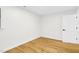 Well-lit bedroom showing hardwood floors and neutral wall color at 301 Lord Berkley Rd, Raleigh, NC 27610