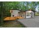 Charming home featuring a freshly painted exterior, a new deck, and professionally landscaped surroundings at 301 Lord Berkley Rd, Raleigh, NC 27610