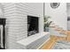 A white brick fireplace with a black interior adjoins a carpeted dining room at 301 Lord Berkley Rd, Raleigh, NC 27610