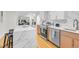 This kitchen features quartz countertops, stainless steel appliances, and an open concept design at 301 Lord Berkley Rd, Raleigh, NC 27610