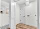 Laundry room featuring tile and vinyl flooring and a doorway to bathroom at 301 Lord Berkley Rd, Raleigh, NC 27610