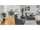 Open-concept living area features comfortable armchairs and view to an open dining area at 301 Lord Berkley Rd, Raleigh, NC 27610