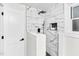 Elegant shower featuring sleek marble-patterned tiles, modern fixtures, and a built-in niche for toiletries at 301 Lord Berkley Rd, Raleigh, NC 27610