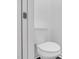 Bright white toilet in small bathroom with white walls at 301 Lord Berkley Rd, Raleigh, NC 27610