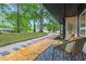 View of the walkway leading to the home's front entrance, with mature trees at 301 Lord Berkley Rd, Raleigh, NC 27610