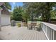Relax on this back deck with outdoor chairs, pillows and a grill at 304 Indigo Pl, Garner, NC 27529