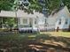 A charming backyard with a wooden deck and screen porch, perfect for outdoor living and entertaining at 304 Indigo Pl, Garner, NC 27529