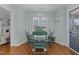 Charming breakfast nook featuring a chandelier and view into the lush landscape at 304 Indigo Pl, Garner, NC 27529