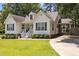 Lovely home with a well-kept lawn, traditional white siding, and a convenient screened-in porch at 304 Indigo Pl, Garner, NC 27529