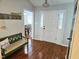 Welcoming foyer with hardwood floors, decorative lighting, and a view into the dining area at 304 Indigo Pl, Garner, NC 27529