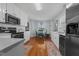 Efficient kitchen boasts white cabinets, stainless steel appliances, and a cozy breakfast nook at 304 Indigo Pl, Garner, NC 27529
