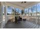 Relaxing screened porch with comfortable seating, providing an ideal space for enjoying the outdoors at 304 Indigo Pl, Garner, NC 27529