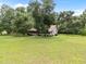 Expansive yard with mature trees, offering a serene setting for this delightful home at 3044 Rock Springs Church Rd, Creedmoor, NC 27522