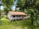 Desirable property with expansive yard and a welcoming front porch at 3044 Rock Springs Church Rd, Creedmoor, NC 27522