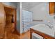 Bathroom with light and dark wood accents, a vanity and a view into the next room at 3044 Rock Springs Church Rd, Creedmoor, NC 27522