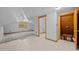 Bright bonus room with tile and carpet flooring, a closet and stairs at 3044 Rock Springs Church Rd, Creedmoor, NC 27522
