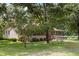 Exterior of a home surrounded by mature trees, offering a serene and private setting at 3044 Rock Springs Church Rd, Creedmoor, NC 27522