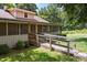 Exterior view of a home with a screened-in porch and accessible ramp at 3044 Rock Springs Church Rd, Creedmoor, NC 27522