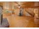 Cozy living area with wood accents, staircase, and brick fireplace at 3044 Rock Springs Church Rd, Creedmoor, NC 27522
