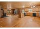 Spacious living room with wood stove, brick fireplace, and kitchen at 3044 Rock Springs Church Rd, Creedmoor, NC 27522