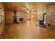 Open living room with two fireplaces, wood-burning stove, and kitchen area at 3044 Rock Springs Church Rd, Creedmoor, NC 27522
