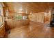 Spacious living room features wood flooring, wood walls and ceilings, and ample natural light at 3044 Rock Springs Church Rd, Creedmoor, NC 27522