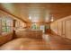 Spacious living room features wood flooring, wood walls and ceilings, and ample natural light at 3044 Rock Springs Church Rd, Creedmoor, NC 27522