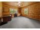 Home office boasts custom wooden cabinets, shelves, and windows at 3044 Rock Springs Church Rd, Creedmoor, NC 27522