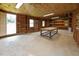 Large workshop with concrete floors, exposed wood framing, workbench, and windows bringing in natural light at 3044 Rock Springs Church Rd, Creedmoor, NC 27522