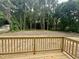 New wooden deck overlooks a cleared and spacious backyard, providing great outdoor living space at 307 N Church St, Kenly, NC 27542