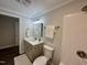 Nicely finished bathroom featuring a modern vanity with updated lighting and shower/tub combination at 307 N Church St, Kenly, NC 27542