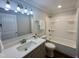 Renovated bathroom with updated fixtures, vanity, and tub/shower, offering a clean, modern feel at 307 N Church St, Kenly, NC 27542