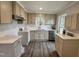 Beautiful kitchen featuring white cabinets, countertops, stainless steel appliances, and tile backsplash at 307 N Church St, Kenly, NC 27542