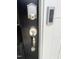 A close up of a smart lock on the black front door with a Ring doorbell at 3105 White Blossom Ct, Raleigh, NC 27610
