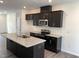 A kitchen island with granite countertops, stainless steel sink, oven, microwave and dark cabinetry at 3105 White Blossom Ct, Raleigh, NC 27610