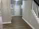 Bright entryway featuring neutral walls, hardwood floors, and a white front door at 3204 Overlook Ct, Burlington, NC 27215