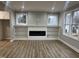 Spacious living room featuring a modern fireplace and built-in bookshelves at 3204 Overlook Ct, Burlington, NC 27215