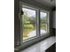 Kitchen window view of a serene pond surrounded by trees, bringing nature indoors at 3204 Overlook Ct, Burlington, NC 27215