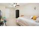 Bedroom featuring a ceiling fan, carpeted floors, neutral walls, and a closet at 33 Village Walk Dr, Chapel Hill, NC 27517