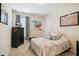 Cozy bedroom with neutral walls, carpet flooring, and a comfortable bed with decorative pillows at 33 Village Walk Dr, Chapel Hill, NC 27517