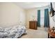 Bedroom featuring carpet floors, neutral walls, a window with curtains, and a wooden dresser at 33 Village Walk Dr, Chapel Hill, NC 27517