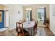 Traditional dining room featuring a six-chair table, beautiful windows, and blue accents at 33 Village Walk Dr, Chapel Hill, NC 27517