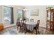 Traditional dining room featuring a six-chair table and plenty of natural light at 33 Village Walk Dr, Chapel Hill, NC 27517