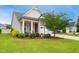 Charming home with a two-car garage, front porch and inviting landscaping at 33 Village Walk Dr, Chapel Hill, NC 27517