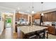 Spacious kitchen featuring granite counters, stainless appliances, and wooden cabinets at 33 Village Walk Dr, Chapel Hill, NC 27517